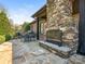 Outdoor stone patio features a fireplace, BBQ grill, and dining area, perfect for entertaining at 2432 Westfield Rd, Charlotte, NC 28207