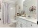 Clean bathroom with a shower, white vanity, and decorative accents at 2894 Westshore Pl, Denver, NC 28037