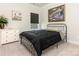 Simple bedroom with a dark comforter, artwork, and natural light at 2894 Westshore Pl, Denver, NC 28037