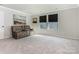 Bonus room with comfortable seating, neutral carpet, and natural light at 2894 Westshore Pl, Denver, NC 28037