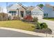 Charming home with stone accents, an attached garage, landscaping, and a well-maintained front yard at 2894 Westshore Pl, Denver, NC 28037