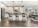 Bright kitchen featuring a large island with barstool seating, pendant lights, and stainless steel appliances at 2894 Westshore Pl, Denver, NC 28037