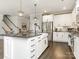 Spacious kitchen with a large island, stainless steel appliances, and a pantry at 2894 Westshore Pl, Denver, NC 28037