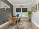 Well-lit home office with a wooden desk, decor, and large windows at 2894 Westshore Pl, Denver, NC 28037