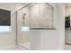 Shower featuring clear glass enclosure and white marble-style tile at 2894 Westshore Pl, Denver, NC 28037