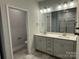 A bathroom with double sinks, a toilet, and a view of the glass shower at 2924 Noritake Trl # 59, Albemarle, NC 28001