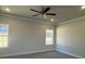 A bright bedroom with two windows and neutral colored walls and carpeting at 2924 Noritake Trl # 59, Albemarle, NC 28001