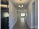 Inviting entryway with modern light fixture and wood-look flooring at 2924 Noritake Trl # 59, Albemarle, NC 28001