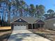 Attractive single-story brick home with a paved driveway and manicured lawn at 2924 Noritake Trl # 59, Albemarle, NC 28001