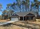 Charming single-story brick home with a well-maintained lawn and an attached two-car garage at 2924 Noritake Trl # 59, Albemarle, NC 28001