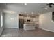 Open-concept kitchen with stainless steel appliances, white cabinetry, and an island at 2924 Noritake Trl # 59, Albemarle, NC 28001