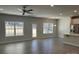 Bright living room with luxury vinyl flooring and large windows overlooking the backyard at 2924 Noritake Trl # 59, Albemarle, NC 28001