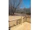 View from a wooden deck overlooking a spacious backyard with trees and a clear blue sky at 2950 Old Cliffside Rd, Shelby, NC 28152