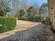 Enjoy the outdoors on the patio and expansive backyard with mature trees at 3142 Wimbledon Ln, Rock Hill, SC 29732