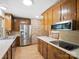 Well-equipped kitchen with wood cabinets, stainless steel appliances, and ample counter space at 3142 Wimbledon Ln, Rock Hill, SC 29732