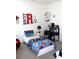 Bedroom with a white bed frame and sports themed decor at 3309 Juneberry Pl, Indian Land, SC 29707