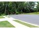 Picture of a cul-de-sac with lush green grass, sidewalks, and a view of the natural surroundings at 3309 Juneberry Pl, Indian Land, SC 29707