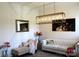 Elegant living room showcasing stylish decor, including a chaise lounge and modern lighting at 3309 Juneberry Pl, Indian Land, SC 29707