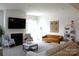 Inviting living room boasts comfortable seating, fireplace, television, and stylish decor elements at 3309 Juneberry Pl, Indian Land, SC 29707
