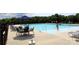 Relaxing community pool area with lounge chairs, umbrellas, and a refreshing swimming pool at 3309 Juneberry Pl, Indian Land, SC 29707