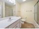 Bathroom featuring vanity with storage, tile floor, and shower with glass doors at 349 Valley Brook Se Ln, Concord, NC 28025