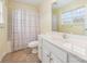 Bathroom featuring vanity with storage, tile floor, and shower and tub combo at 349 Valley Brook Se Ln, Concord, NC 28025