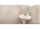 Neat half bathroom featuring a pedestal sink and neutral wall paint at 349 Valley Brook Se Ln, Concord, NC 28025