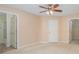 Neutral bedroom with fan, carpeted floor, and ensuite bathroom and walk-in closet at 349 Valley Brook Se Ln, Concord, NC 28025