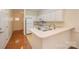 Bright kitchen features white cabinetry, modern appliances, and an adjacent breakfast bar at 349 Valley Brook Se Ln, Concord, NC 28025