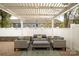Backyard patio with pergola and comfortable outdoor seating, ideal for relaxing and entertaining guests at 4022 Carl Parmer Dr, Harrisburg, NC 28075