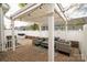 Backyard patio with pergola and wicker furniture, an inviting spot for outdoor gatherings and leisure at 4022 Carl Parmer Dr, Harrisburg, NC 28075