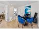 A dining area displaying bright blue chairs, neutral walls, and contemporary wall art at 4022 Carl Parmer Dr, Harrisburg, NC 28075