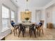 Open dining room featuring modern lighting and decor, with hardwood floors at 4022 Carl Parmer Dr, Harrisburg, NC 28075
