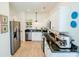 Modern kitchen features stainless steel appliances, white cabinets, and granite countertops at 4022 Carl Parmer Dr, Harrisburg, NC 28075