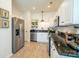 Kitchen featuring stainless steel appliances, white cabinets, granite countertops and hardwood floors at 4022 Carl Parmer Dr, Harrisburg, NC 28075