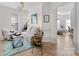 Cozy living room features neutral furniture, a light fixture, and access to another bedroom at 4022 Carl Parmer Dr, Harrisburg, NC 28075