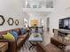 Open concept floor plan with living room and dining room featuring hardwood floors and stylish decor at 4022 Carl Parmer Dr, Harrisburg, NC 28075