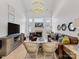 Bright living room featuring a fireplace, hardwood floors and large windows at 4022 Carl Parmer Dr, Harrisburg, NC 28075