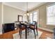 Cozy dining area featuring a table with seating, a chandelier, and natural light from the windows at 4103 Belle Meade Cir, Belmont, NC 28012