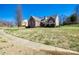Beautiful brick home with a well-manicured lawn and mature landscaping at 4103 Belle Meade Cir, Belmont, NC 28012