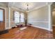 Spacious living area featuring hardwood floors, elegant columns, and natural light at 4103 Belle Meade Cir, Belmont, NC 28012