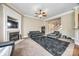 Comfortable living room featuring a fireplace, neutral carpet, and views to the staircase and kitchen at 4103 Belle Meade Cir, Belmont, NC 28012