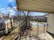 Relaxing balcony view overlooking the lake with mature trees, perfect for enjoying nature at 4824 Spring Lake Dr # E, Charlotte, NC 28212