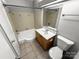 Bathroom with a bathtub, toilet and vanity at 4824 Spring Lake Dr # E, Charlotte, NC 28212