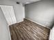 Clean bedroom with hardwood floors and a double door closet at 4824 Spring Lake Dr # E, Charlotte, NC 28212