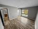 This bedroom boasts beautiful floors and natural light from the lovely window at 4824 Spring Lake Dr # E, Charlotte, NC 28212