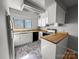 Well-lit kitchen featuring wood countertops, white cabinets, black appliances, and a view to the outdoors at 4824 Spring Lake Dr # E, Charlotte, NC 28212
