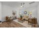 Bright living room featuring a ceiling fan, stylish furniture, and natural light at 5013 Cherry Gum Ct, Matthews, NC 28105