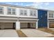 Townhome featuring spacious two car garage with an automatic door and ample parking at 5025 Cherry Gum Ct # 47, Matthews, NC 28105