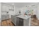 Modern kitchen boasts granite countertops, stainless steel appliances, and an open layout into the living space at 5025 Cherry Gum Ct # 47, Matthews, NC 28105